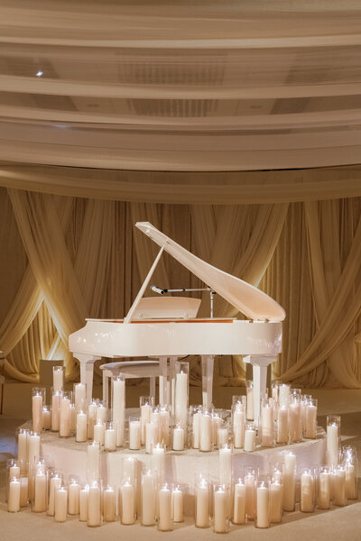 ​Tiffany and Dakari's wedding at Hotel AKA Alexandria in Virginia featured an intimate ceremony with 38 guests, a monochromatic black and cream palette, and a reception illuminated by over 1,000 candles, creating a romantic and atmospheric ambiance. 