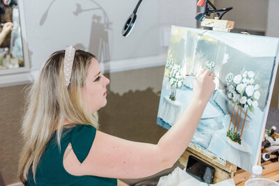 Live wedding painter in action at wedding reception in Washington, DC