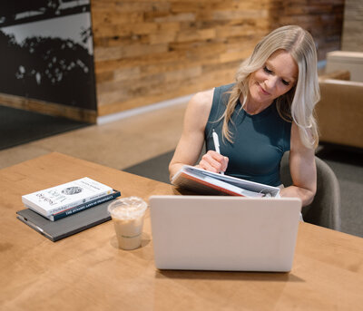 Stacie on a video call with one of her clients as she sits in front of her computer