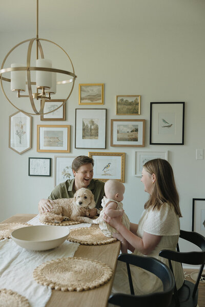 Family posing in newborn's nursery during RVA newborn photographers session