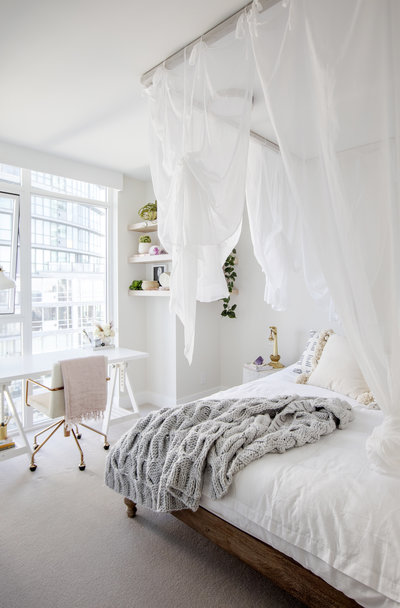 Office and Guest Bedroom l White Sheer Fabric draping like Canopy over Wood Bed Frame with Cozy White Sheets and Grey Knitted Throw