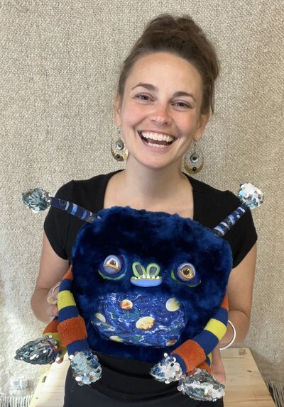 Natalie holding Handcrafted stuffed toy