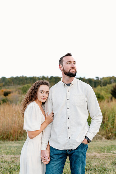 couple posing at vineyard