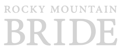 A white version of the Rocky Mountain Bride logo.