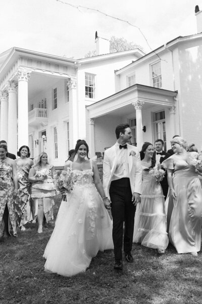 bride holding her hand on hip and smiling