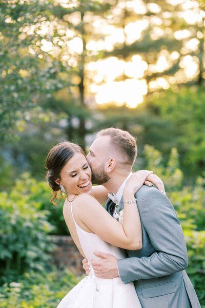 Groom kissing bride
