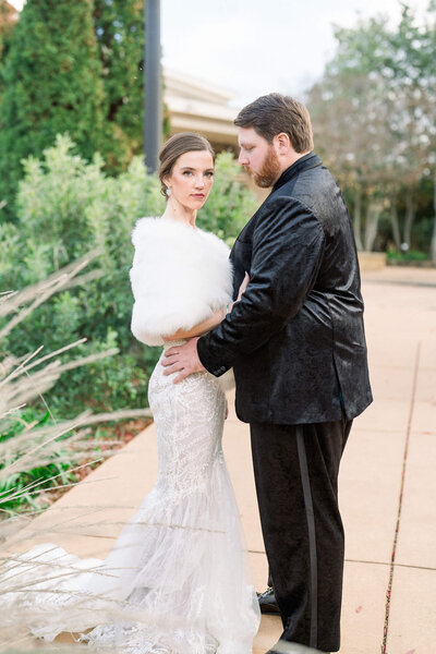Winter wedding elegance with a bride in a fur wrap. Captured by Jackson Ms Wedding Photographer.