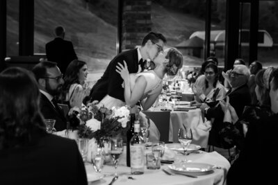 Groom Dips Bride at Alpine Ski Wedding