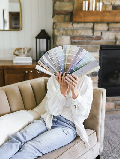 Designer exploring tones and textures for cohesive home palette.