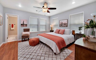Master bedroom with private bath and King size bed in this three-bedroom, two-bathroom vacation rental home with historical charm in Waco, TX.