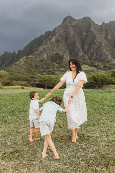 Family and Maternity Photographer,  family in the water in Hawaii beach
