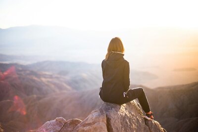 A lady sitting in awe of nature