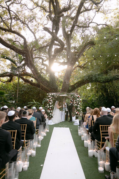 Wedding ceremony under tree taken by one of the top orlando photographers, Marissa Nicole