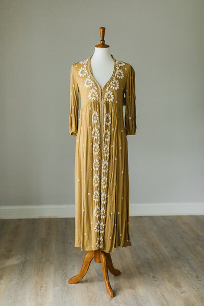 free people long sleeved dress in mustard color with white embroidery