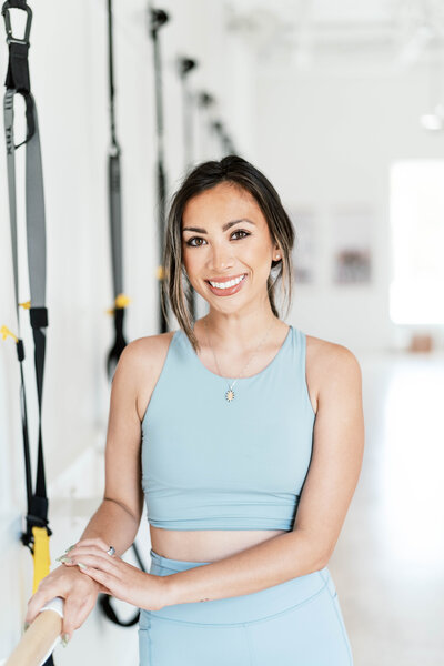 Fitness studio headshot of Sophia Cheatwood, Co Owner of True40 Gardendale with minimal background