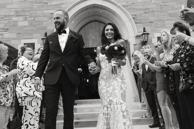 Newlyweds exit their wedding ceremony