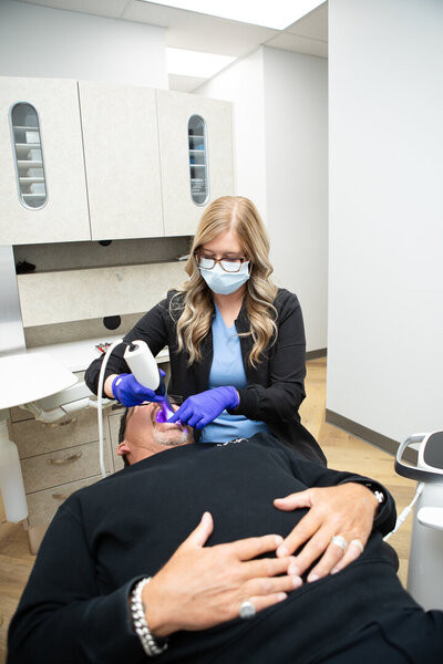 Prosthodontist treating a dental patient