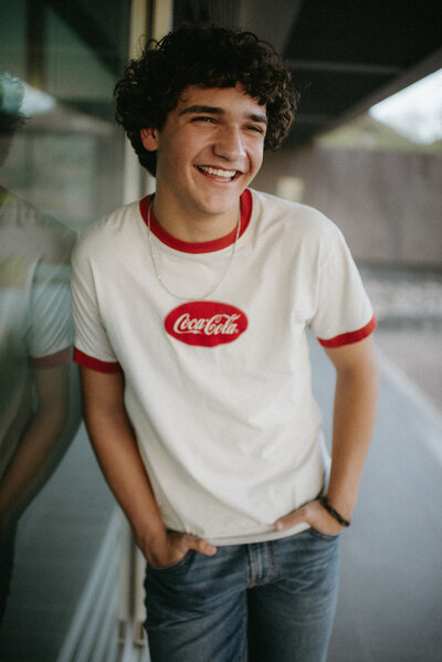 graduate laughing in a vintage shirt in Scottsdale