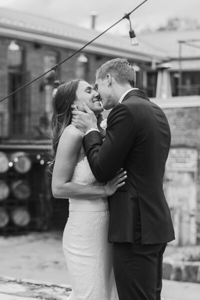 bride and groom share steamy kiss at city winery wedding in hudson valley