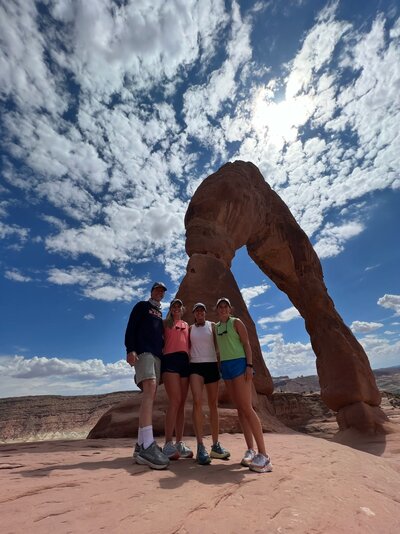 Libby Glisson hiking toward Delicate Arch in Utah