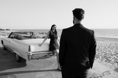 family standing on beach in southern california