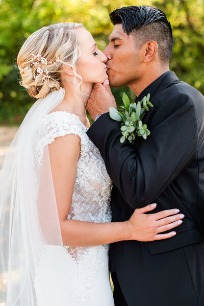 Bride and Groom kissing at Barn at Harvest Moon Pond Wedding