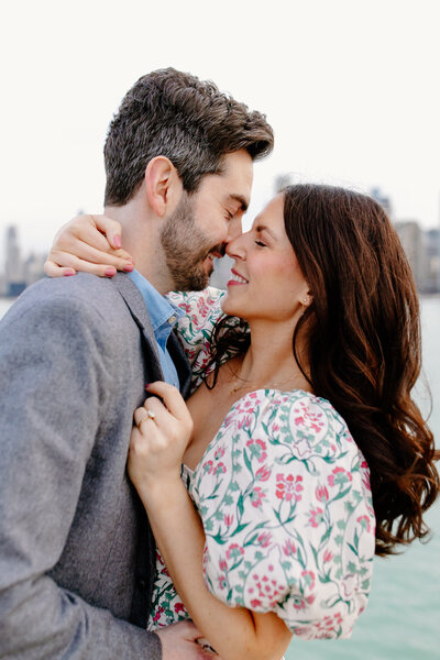 Engaged couple kiss at North Ave Beach in Chicago