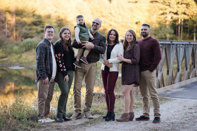 Close family picture with toddler boy, mom, dad, aunt, uncle, and grandparents