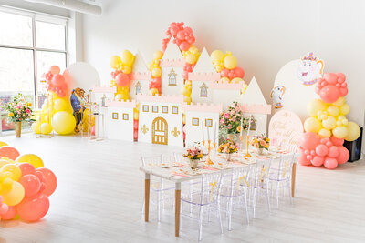 The artistry of Air with Flair Decor on our page, featuring a stunning custom balloon installation adorned with fancy green branches. The unique designs and creative flair that define our balloon decor.