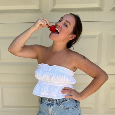 Mariah Berendt eats a strawberry.