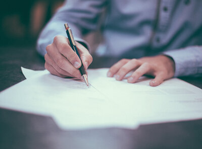 a consultant at work with a pen and paper