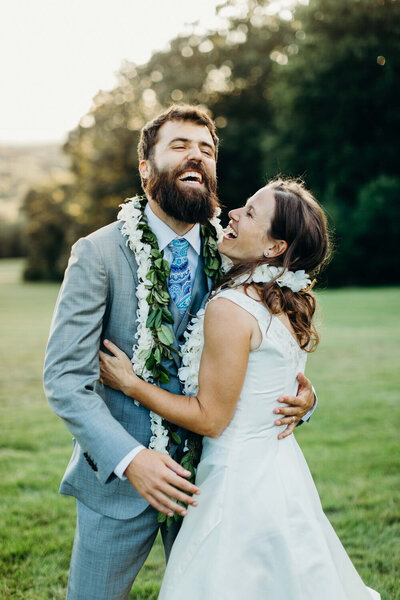 bride and groom holding eachother