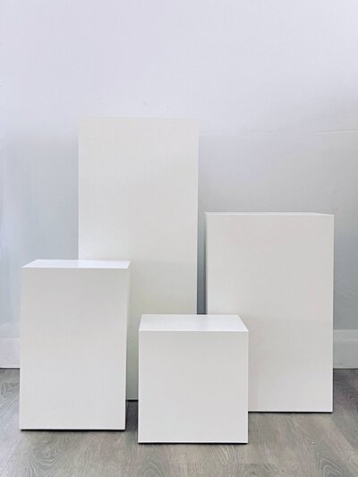 pedestal riser column display structure rental white modern stone prop elevated centerpiece ornate