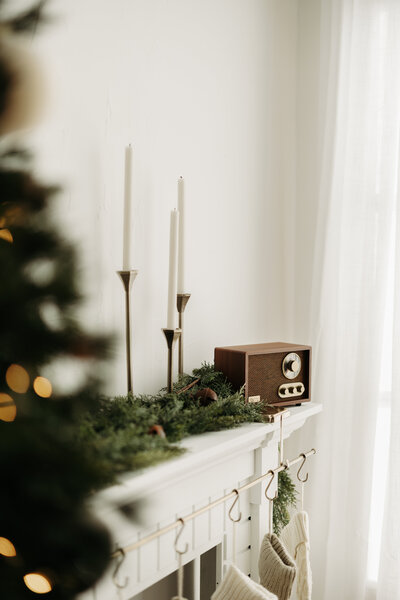 Woman smiling at camera sitting by brick wall