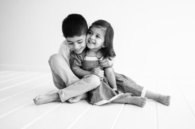 Black and white photo of siblings