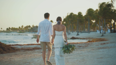couple holding hands on beach