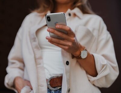 Image of person holding cell phone
