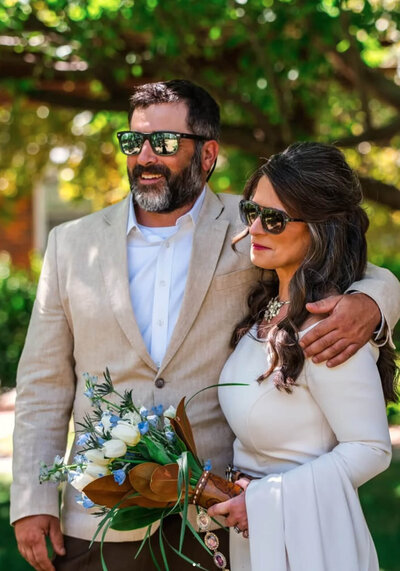 Bride and groom standing outdoors in Billings, Montana after their luxury wedding at the Billings Depot.