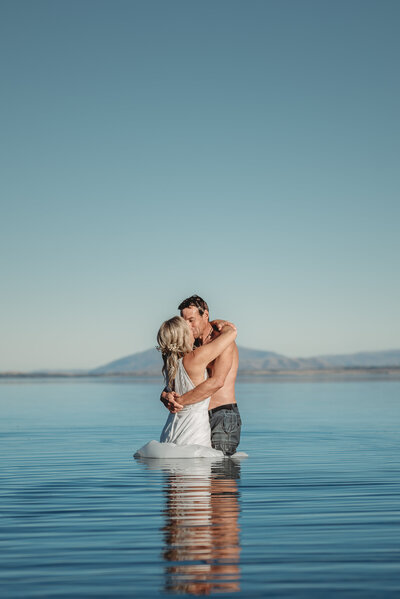 Queenstown elopement couple standing in the water in their wedding attire