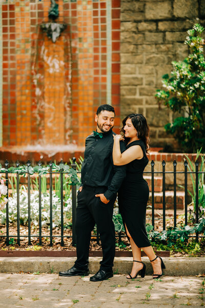 Engaged  Atlanta couple embracing outdoors, radiating joy and connection. A timeless moment of love captured in natural light.