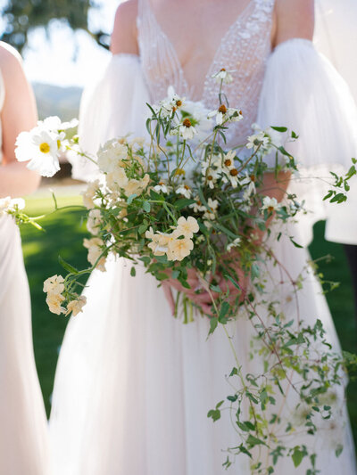 Bride holding organic style bouquet
