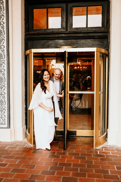 The couple exiting the front  revolving doors of the Arlington Hotel in Hot Springs, AR