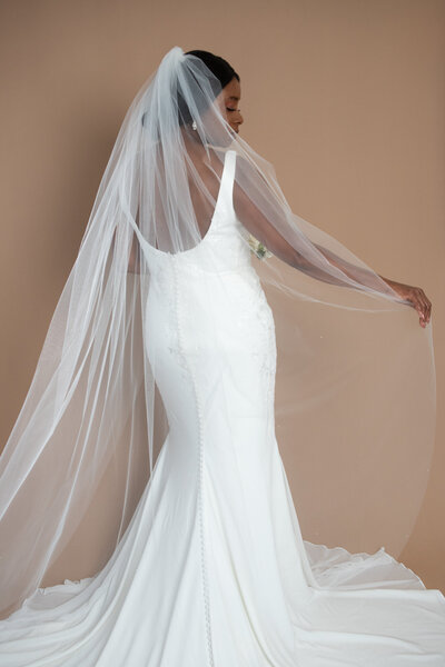 bride wearing a floor length veil