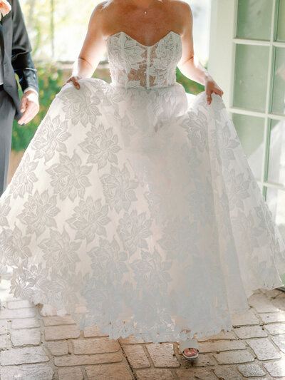 bride running through a greenhouse on her wedding day.