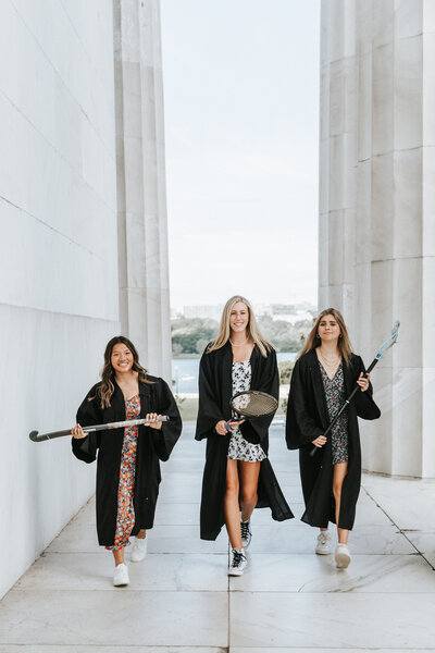 High school seniors walking together at DC monuments for senior portrait session