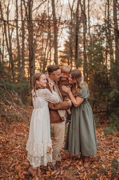 A family embracing in a hug at sunset at the Pipestem Nature Center in Princeton, West Virginia