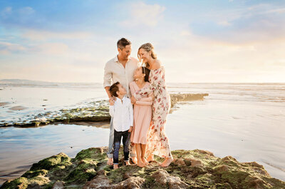 photo of a family on the beach by Carlsbad family photographer Tristan Quigley