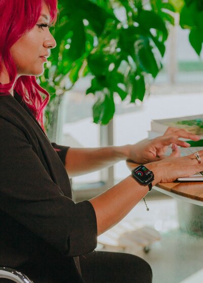 Digital strategist typing on a laptop