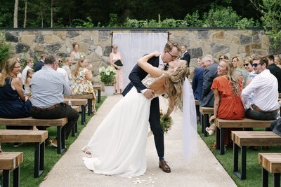 An indie LGBTQ+ couple’s moody editorial elopement portrait, photographed in a true-to-color style by Chelsea Stanford in Missouri