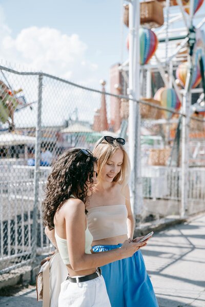 Photo by Katya Wolf: https://www.pexels.com/photo/smiling-women-looking-together-at-smartphone-8734286/